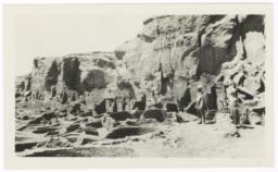 Man and Woman Standing in Front of Cave Formations