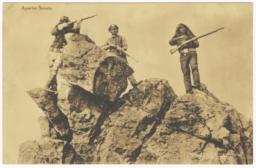 Apache Scouts with Guns Posed by Rock Outcropping