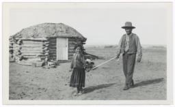 Young Navajo Girl Guiding a Blind Man, Chinle, Arizona
