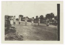 American Indian Men Competing in a Sack Race