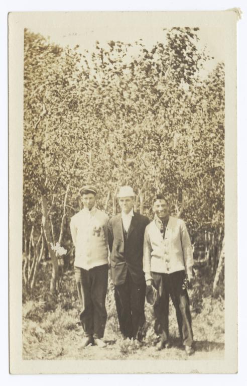 Three Men Posing for the Camera