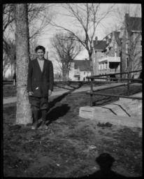 Young Man Standing on the Grounds of Haskell Institute, Lawrence, Kansas