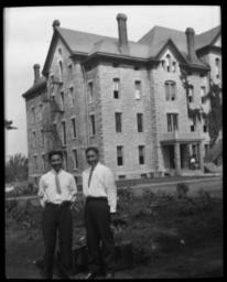 Two Men in front of Building
