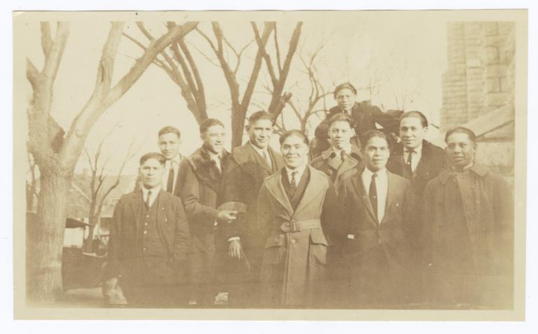 Group of Young Men Gathered under Trees