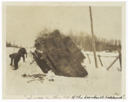 View of Overturned Sled Piled with Hay at the Side of a Road, Minnesota