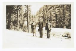 Miss Bertha M. Eckert, Reverend G.A. Watermulder, and Mr. M.K. Sniffen beside Idaho Mountain Stream