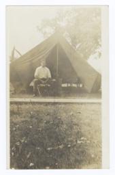 Young American Indian Man in front of Tent
