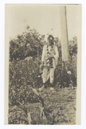American Indian Man in Traditional Dress in Field