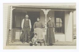 American Indian Couple with Young Woman and Baby in front of House, Nebraska