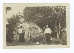 Two Men in Front of Wickiup