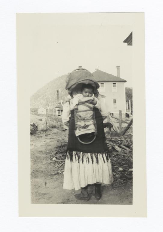 Woman with Infant in Cradleboard on Her Way to Church, Mescalero, New Mexico