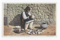 Woman of Isleta Decorating Pottery