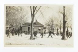 Large Group Snow Ball Fight on a Snow Covered Campus
