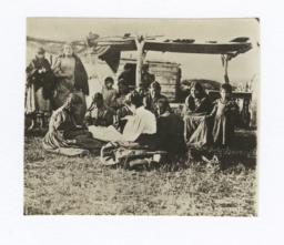 Group of Native American Women and Children Listening to Woman Reading