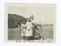 Girls at Pawnee School Posing next to School Bell, Oklahoma