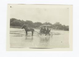 Three Men in Horse and Buggy Crossing a River