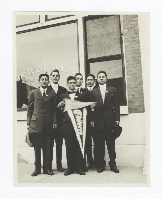 Young Men Holding Chilocco and YMCA Pennants Standing  in front of the Hotel Havlin