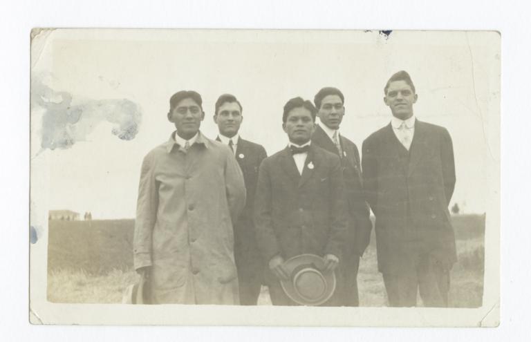 Five Men Wearing Suits and Ties Posed Standing in a Field