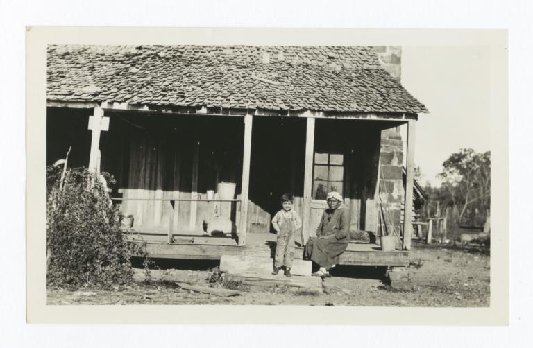 Cherokee Woman and Boy on Porch and Steps, Cherokee County, Oklahoma