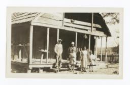 Boy, Girls and Woman Posing in front of a House with an Overhead Loft, Cherokee County, Oklahoma