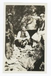 Woman and Two Men in front of an Entrance to a Cave that Was Used by Outlaws to Hide
