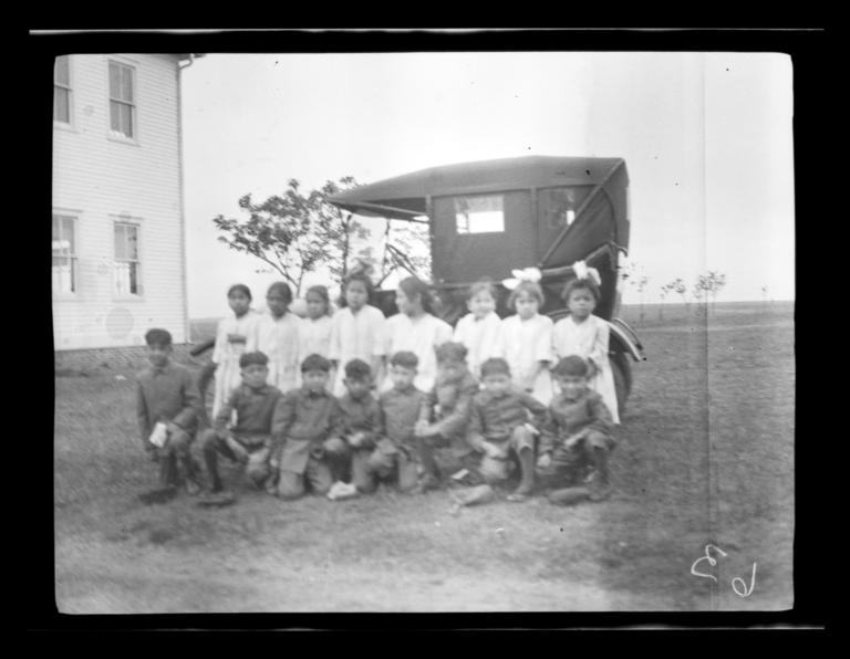 Group Posing in front of Automobile at Cantonment School, Oklahoma