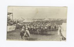 Group of American Indians on Horses Parading in front of Grandstands