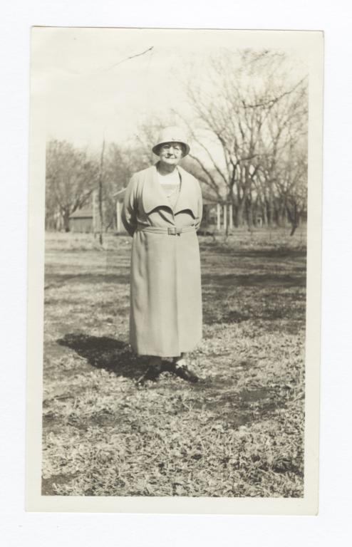 Elderly Woman Standing in a Field