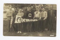 Group of Men Holding Pennants Reading "Chemawa"