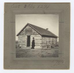 Man Standing in front of the Y.M.C.A. Building on Pine Ridge Reservation, South Dakota