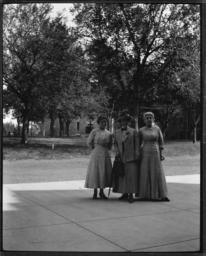 Three Women Posing for the Camera