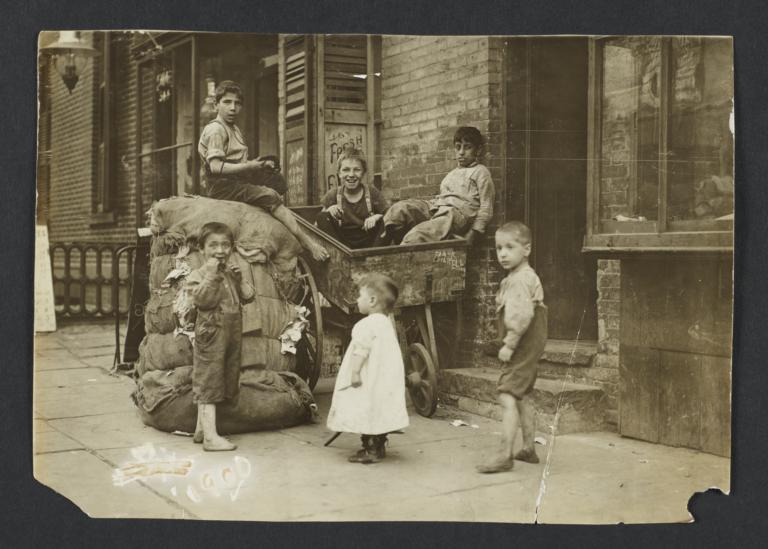 Children with Burlap Sacks and Wheelbarrow