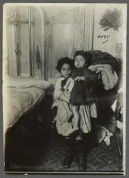 Two Children Beside Bed