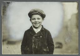 Boy in Cap with Front Teeth Missing