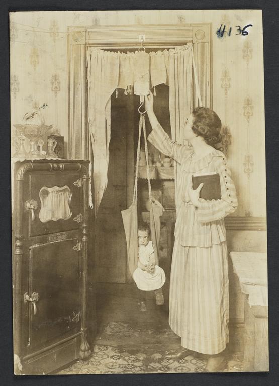 Mulberry Health Center Album -- Dietician Weighing Child