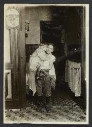 Boy Holding a Small Child