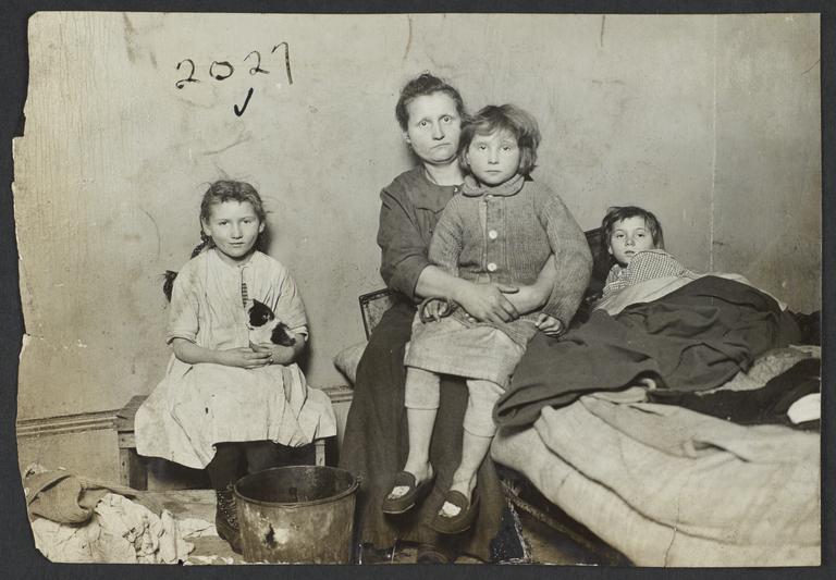 Mother and Three Children in Tenement Room
