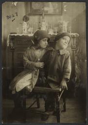 Two Children on Broken Chair