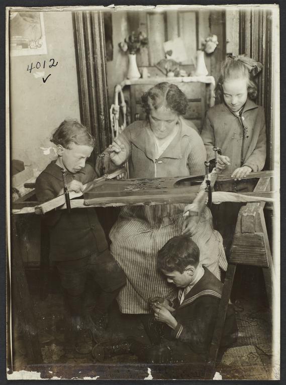 Children with Woman Sewing 