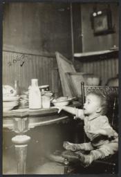 Child Reaching for Milk