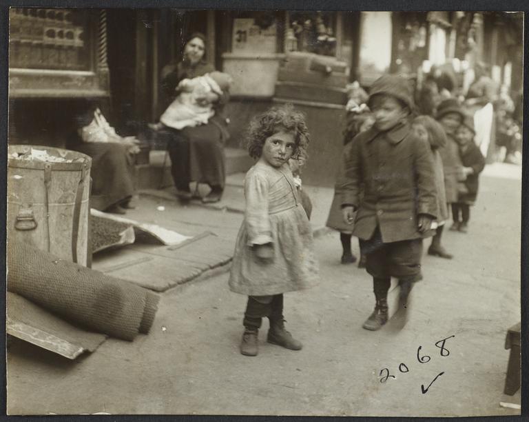 Little Girl with Children on Sidewalk