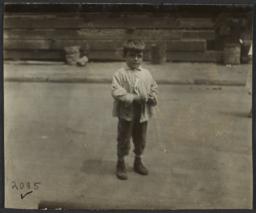 Boy Alone on Street