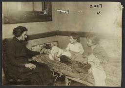 Woman with Children on Bed