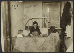 Woman in Bed with Two Children