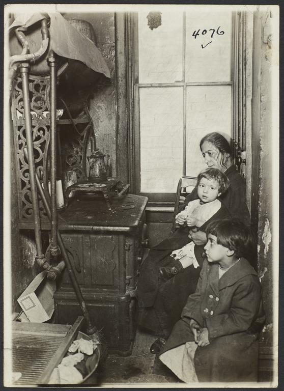 Woman and Children near Stove