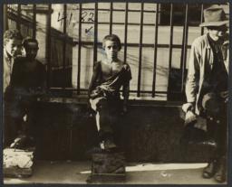 Shoeshiners in Front of Library