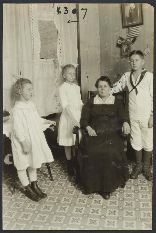Seated Woman  with Three Standing Children