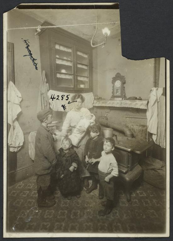 Mother with Baby and Four Boys