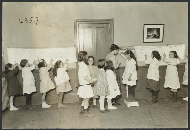 Mulberry Health Center Album -- Girls Pointing to Weight on Charts