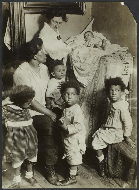 Columbus Hill Health Center Album -- Woman  with Five Children and Nurse
